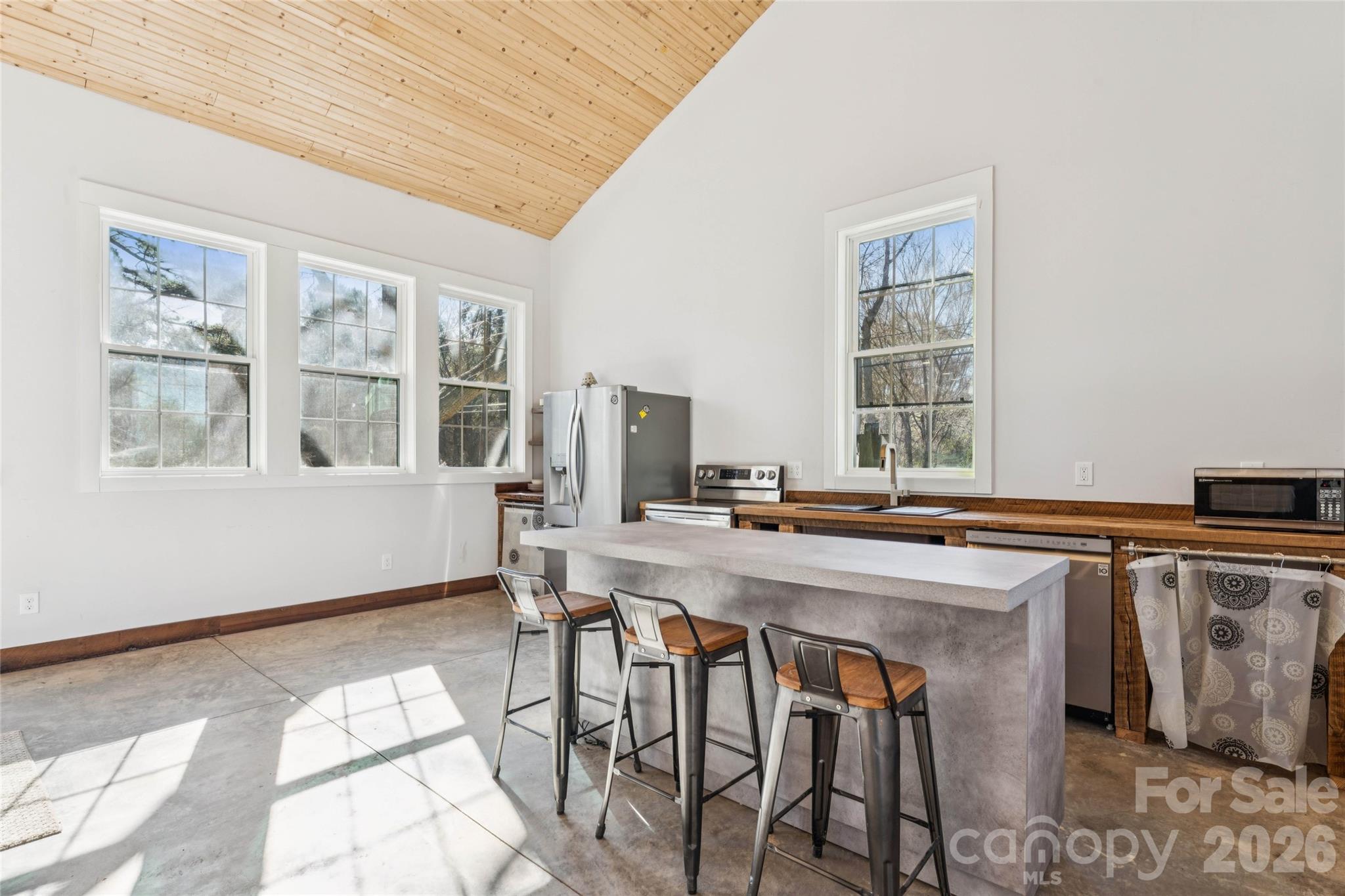 10799 Poplar Tent Road Huntersville, NC 28078 - Photo 13 of 46 a view of a dining room with furniture window and wooden floor