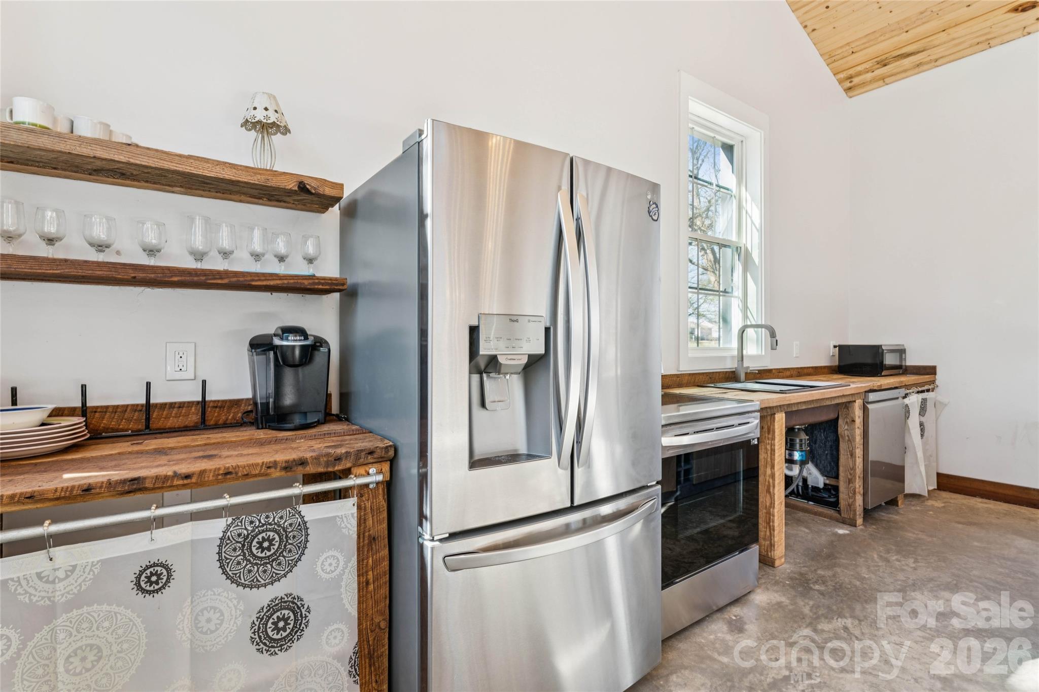 10799 Poplar Tent Road Huntersville, NC 28078 - Photo 15 of 46 a kitchen with stainless steel appliances granite countertop a refrigerator a stove and a sink with dishwasher