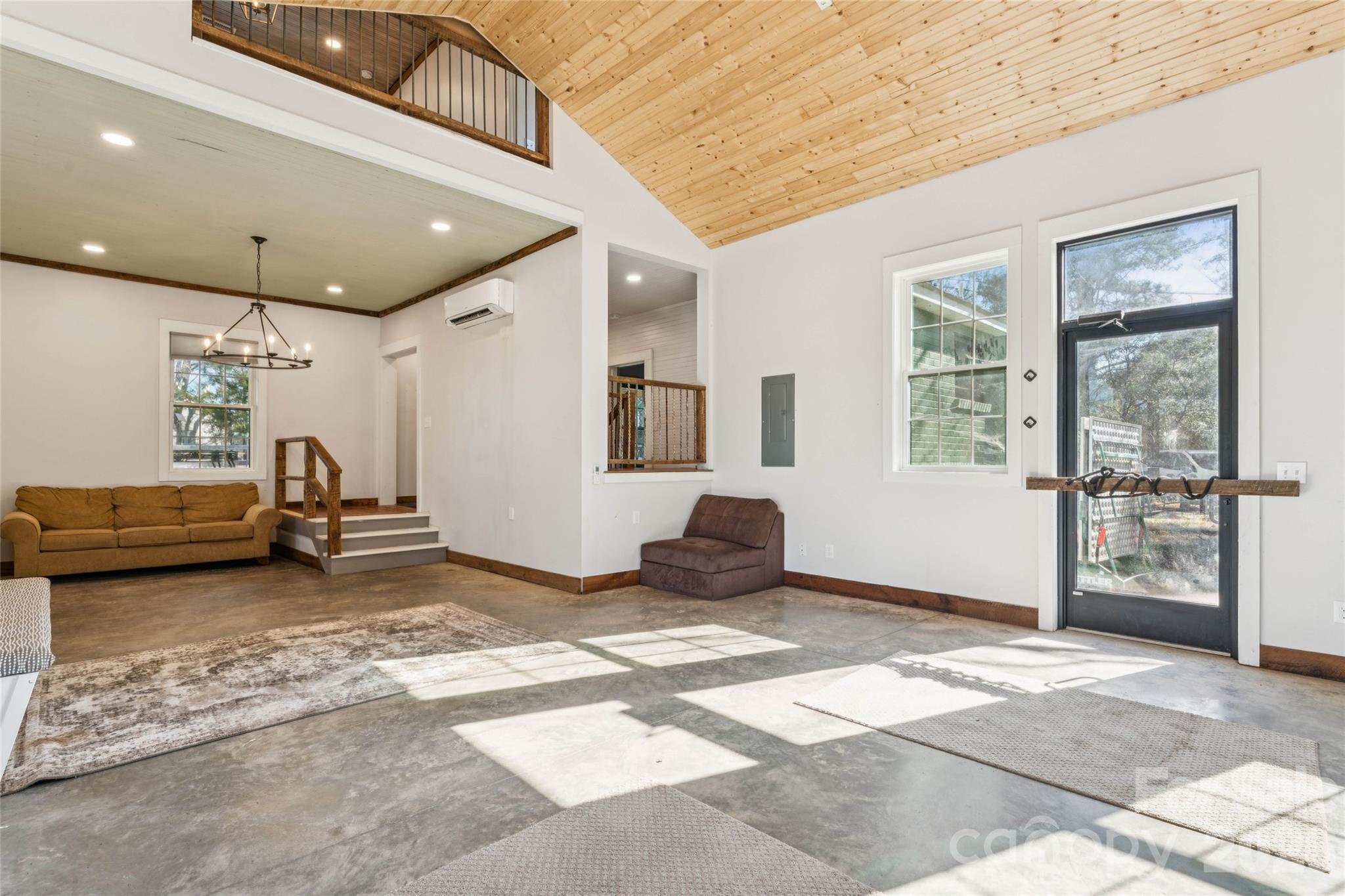 10799 Poplar Tent Road Huntersville, NC 28078 - Photo 18 of 46 a view of a livingroom with furniture and a window