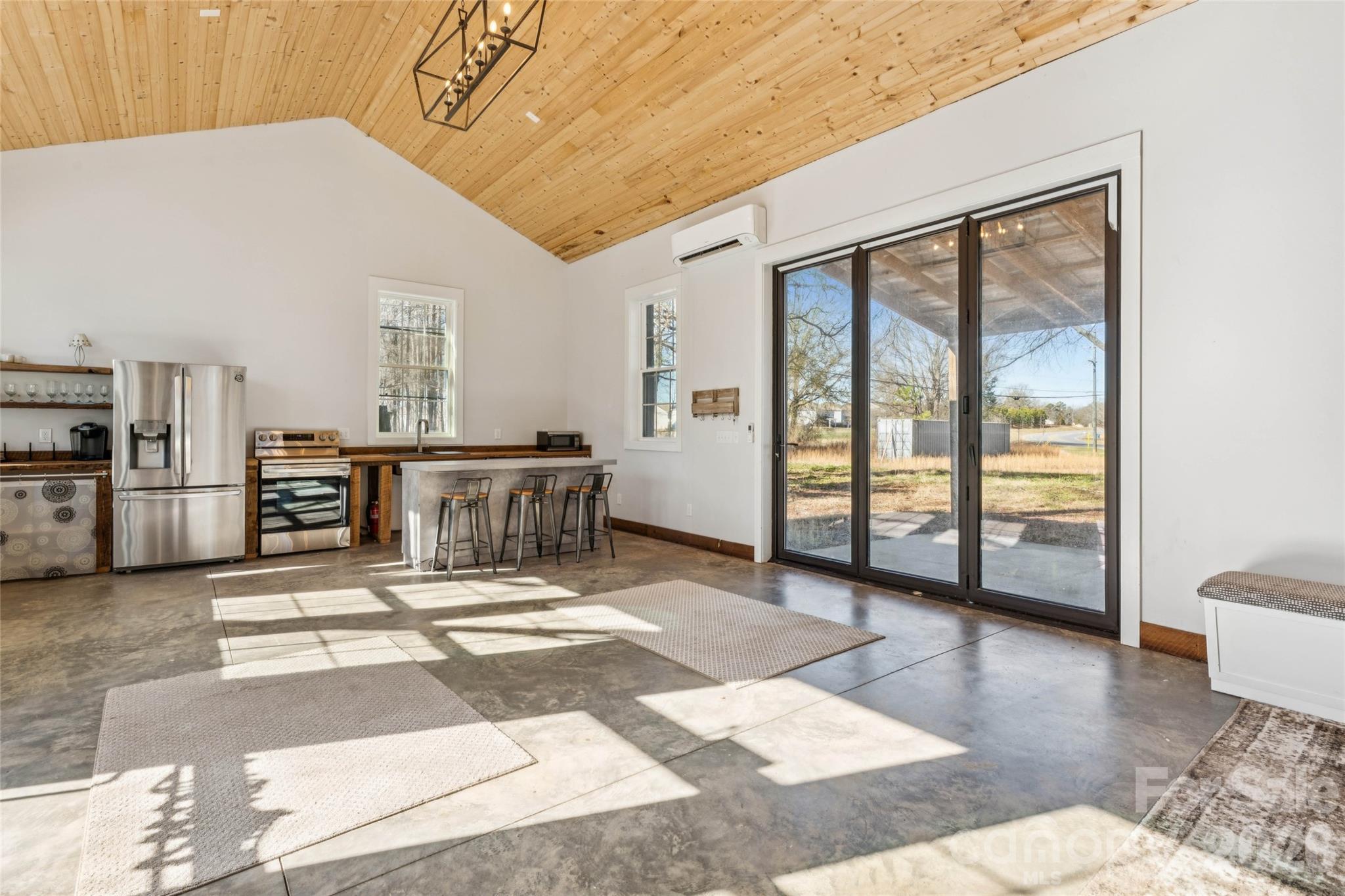10799 Poplar Tent Road Huntersville, NC 28078 - Photo 20 of 46 a living room with a large window and furniture