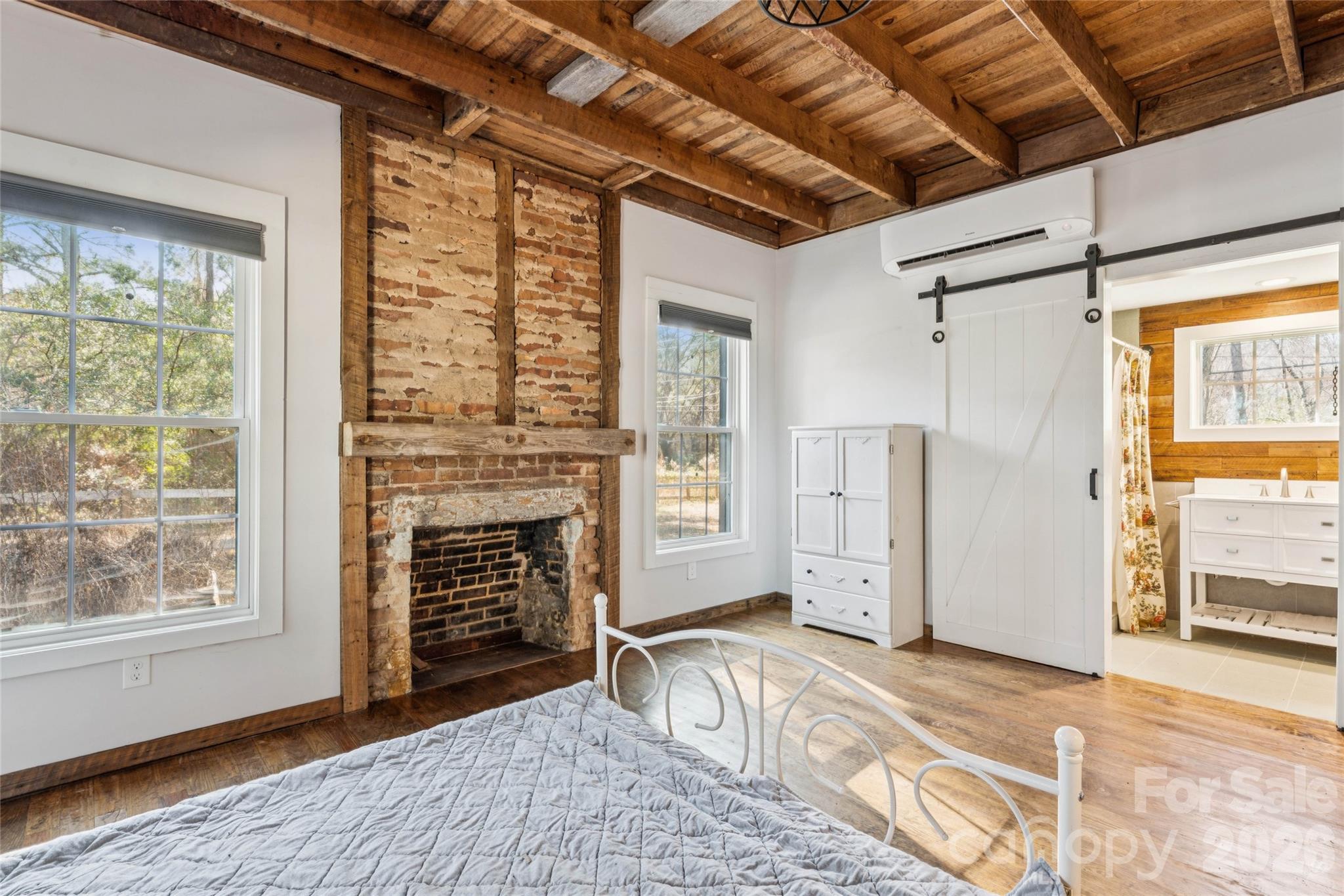 10799 Poplar Tent Road Huntersville, NC 28078 - Photo 21 of 46 a view of an empty room with a fireplace and a window