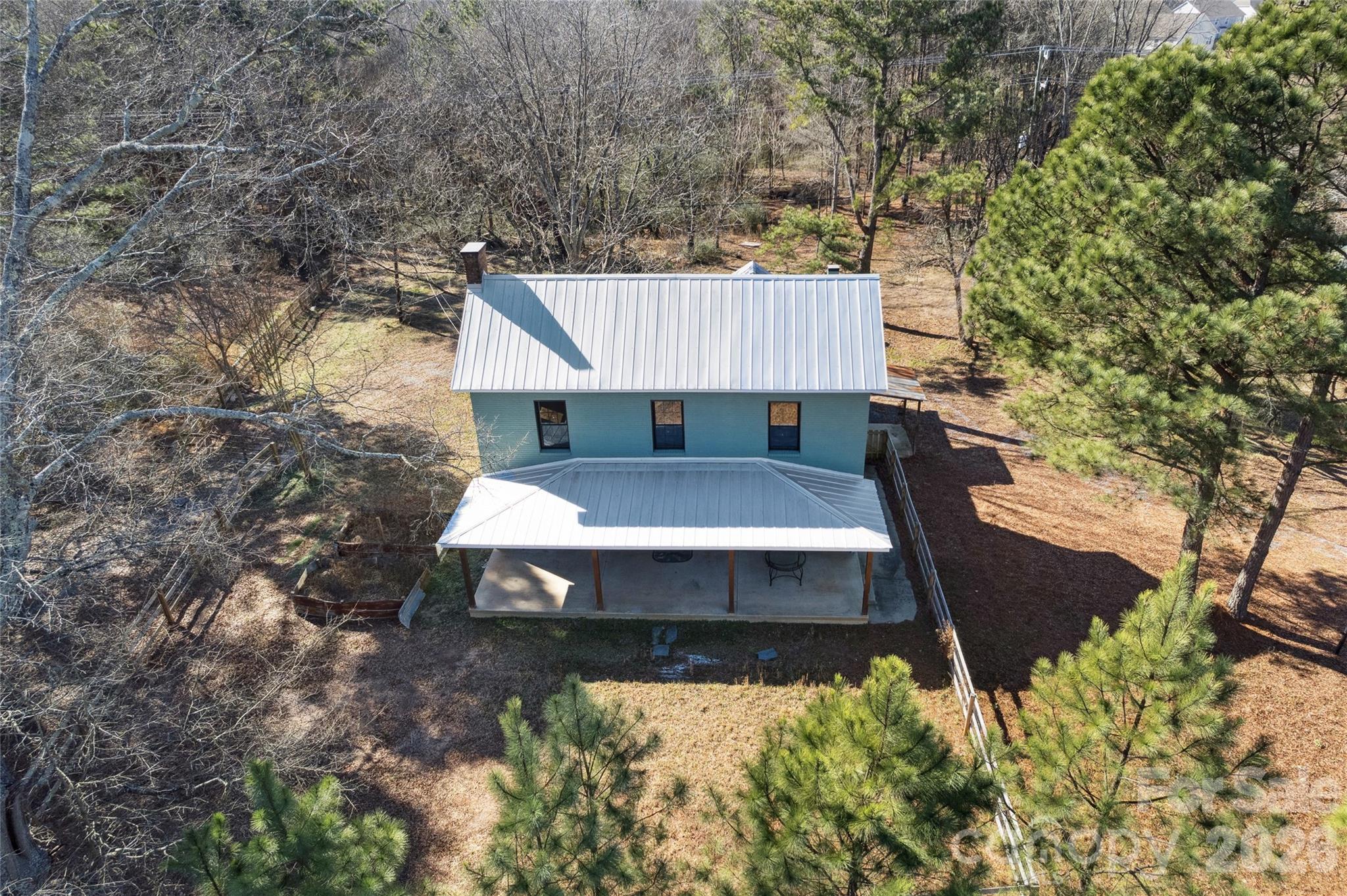 10799 Poplar Tent Road Huntersville, NC 28078 - Photo 4 of 46 a view of a house with a yard and sitting area