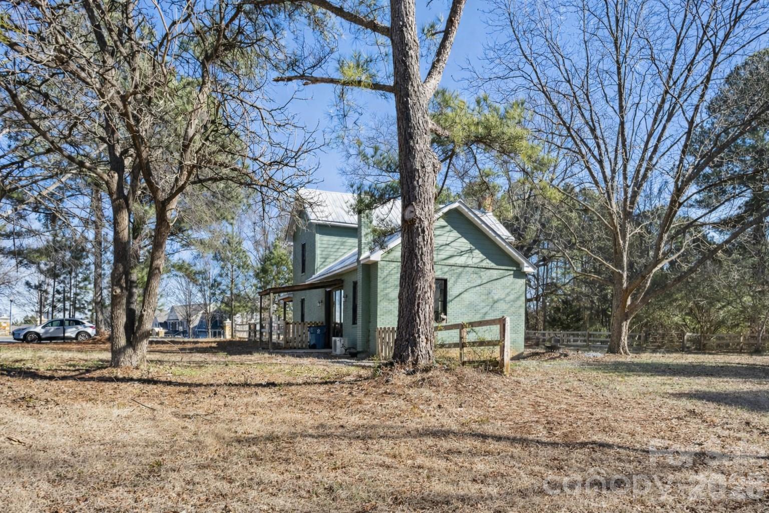 10799 Poplar Tent Road Huntersville, NC 28078 - Photo 41 of 46 a front view of a house with a yard and garage