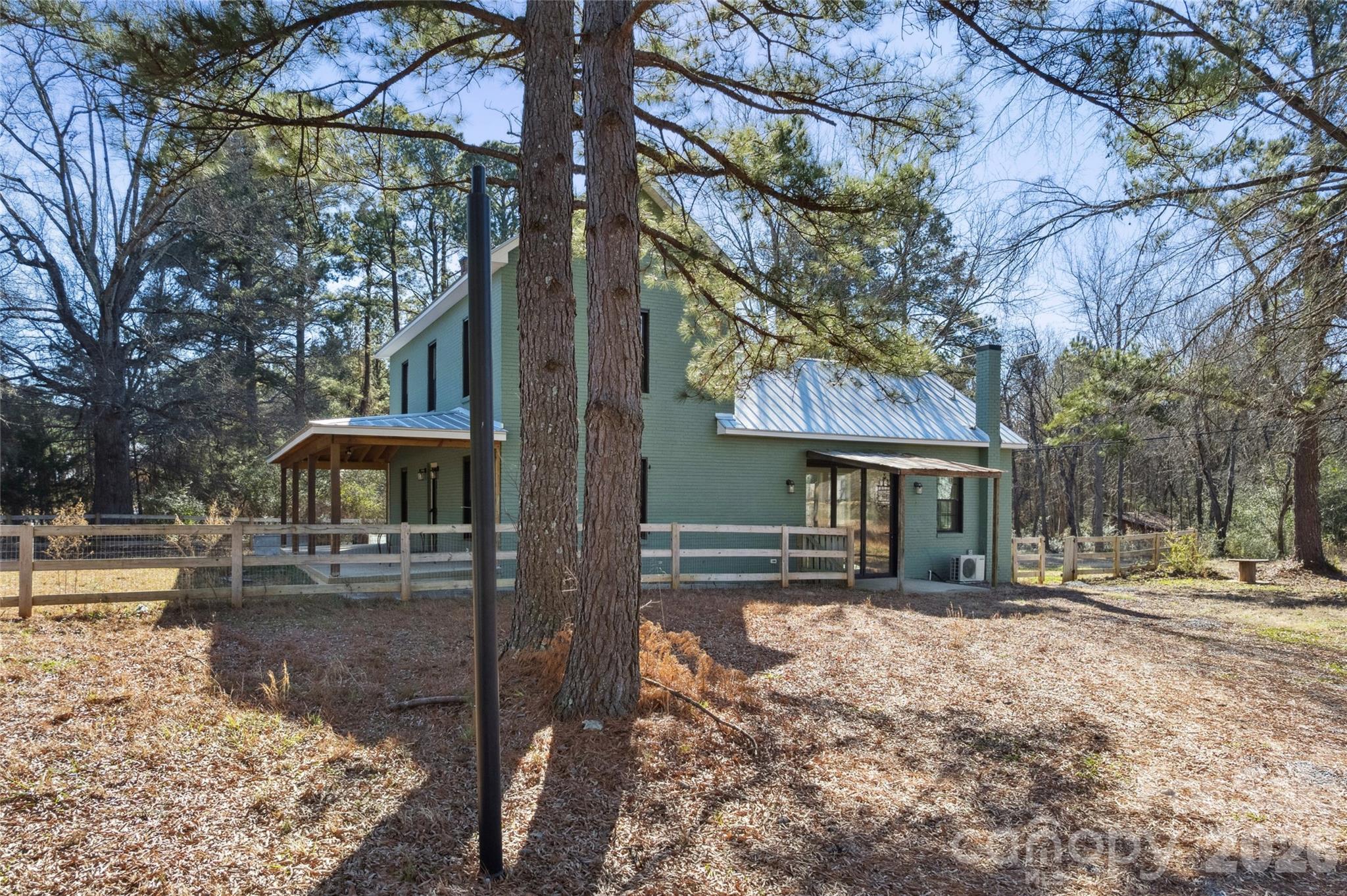 10799 Poplar Tent Road Huntersville, NC 28078 - Photo 42 of 46 a front view of a house with a yard covered with snow