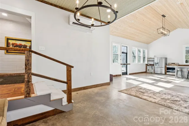 a view of a livingroom with furniture and a ceiling fan