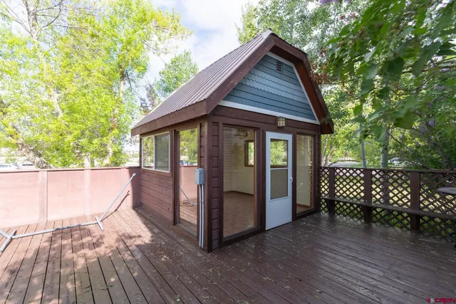 a view of a house with a yard and wooden floor