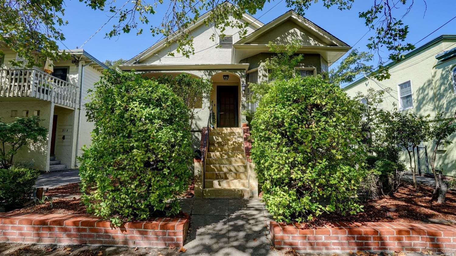 front view of a house with a small yard