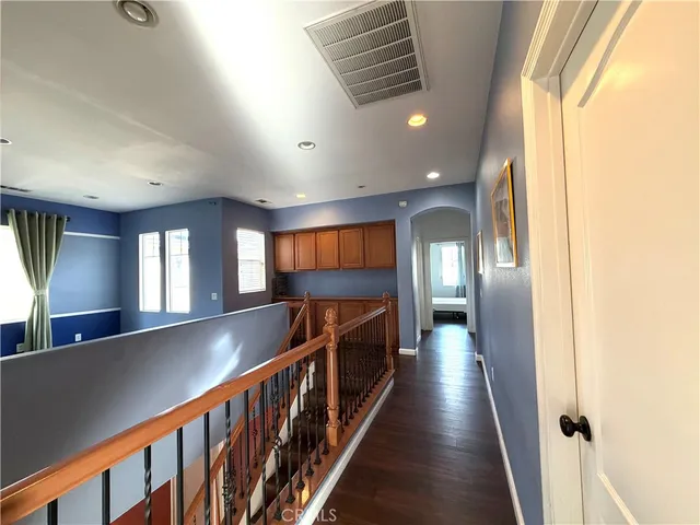 a view of gallery with wooden floor