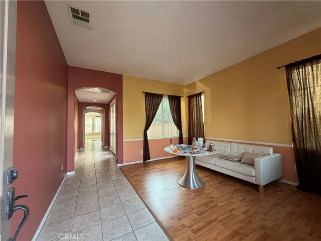 a living room with furniture and a yard