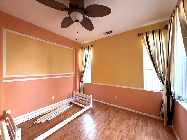 a view of room with window and ceiling fan