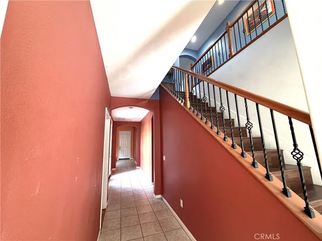 a view of staircase with railing and stairs