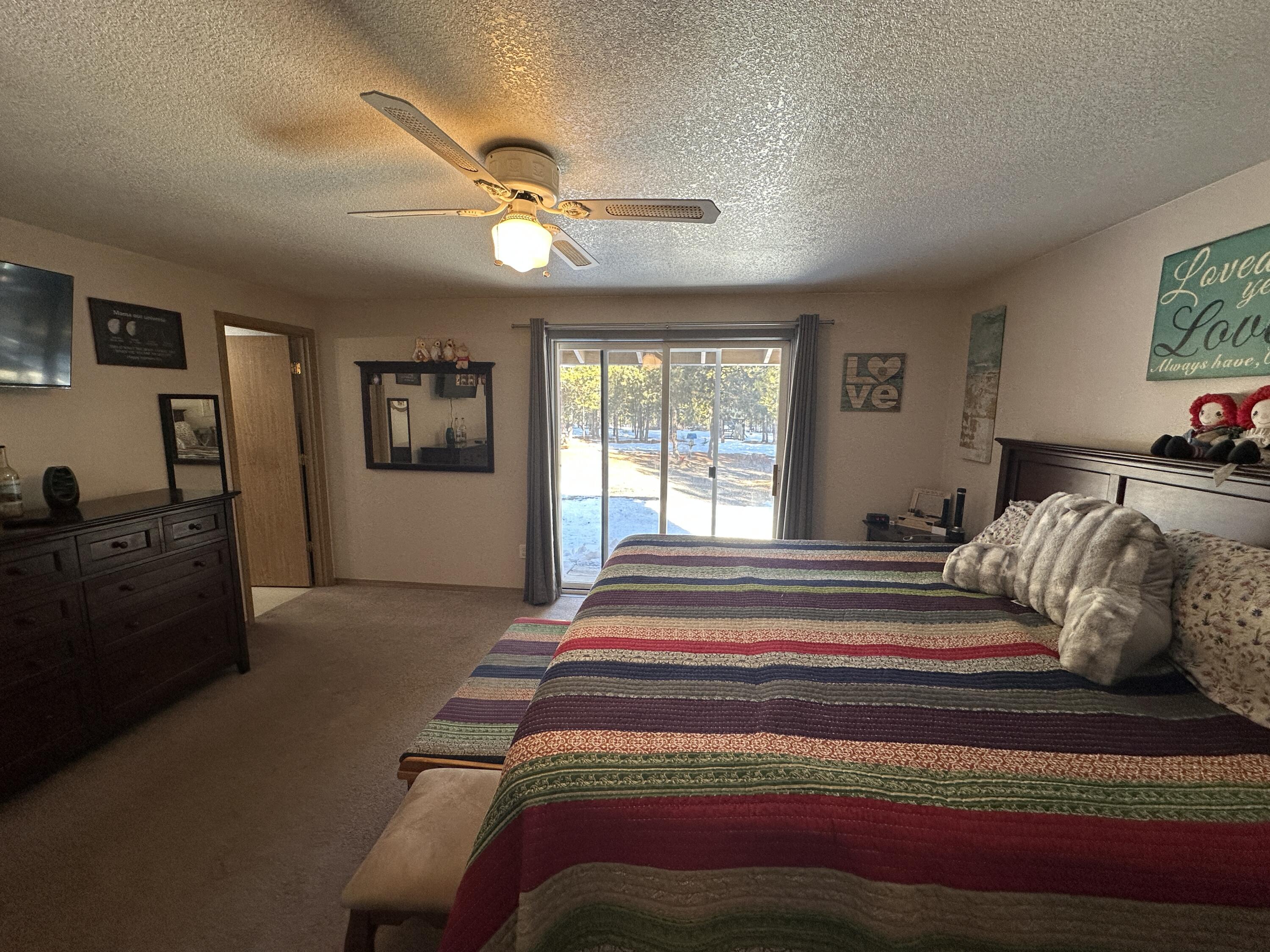 123977 Surveyor Road Crescent Lake, OR 97733 - Photo 37 of 41 a bedroom with a large bed and a window