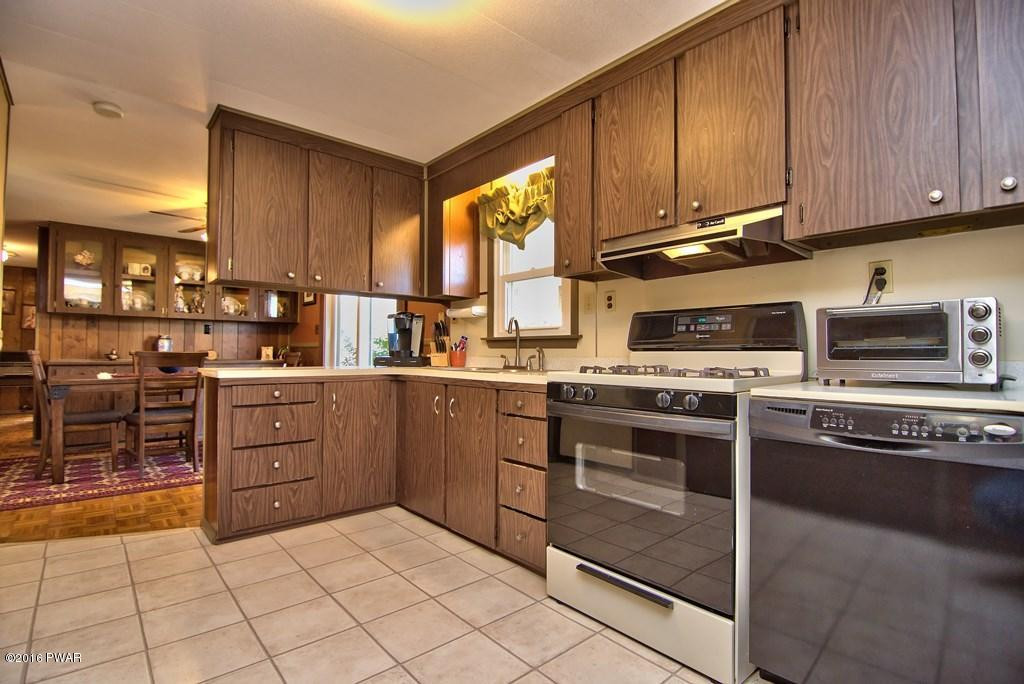 3321 Aberdeen Road Moscow, PA 18444 - Photo 2 of 20 a kitchen with a stove a sink and a microwave