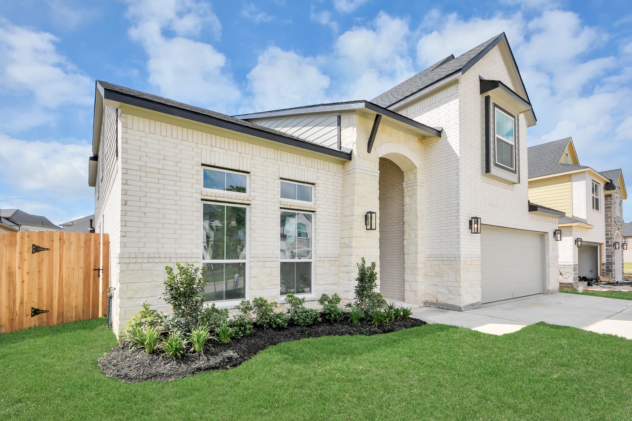 Home features a convenient 2-car garage complemented by a spacious driveway, offering ample parking for you and your guests.