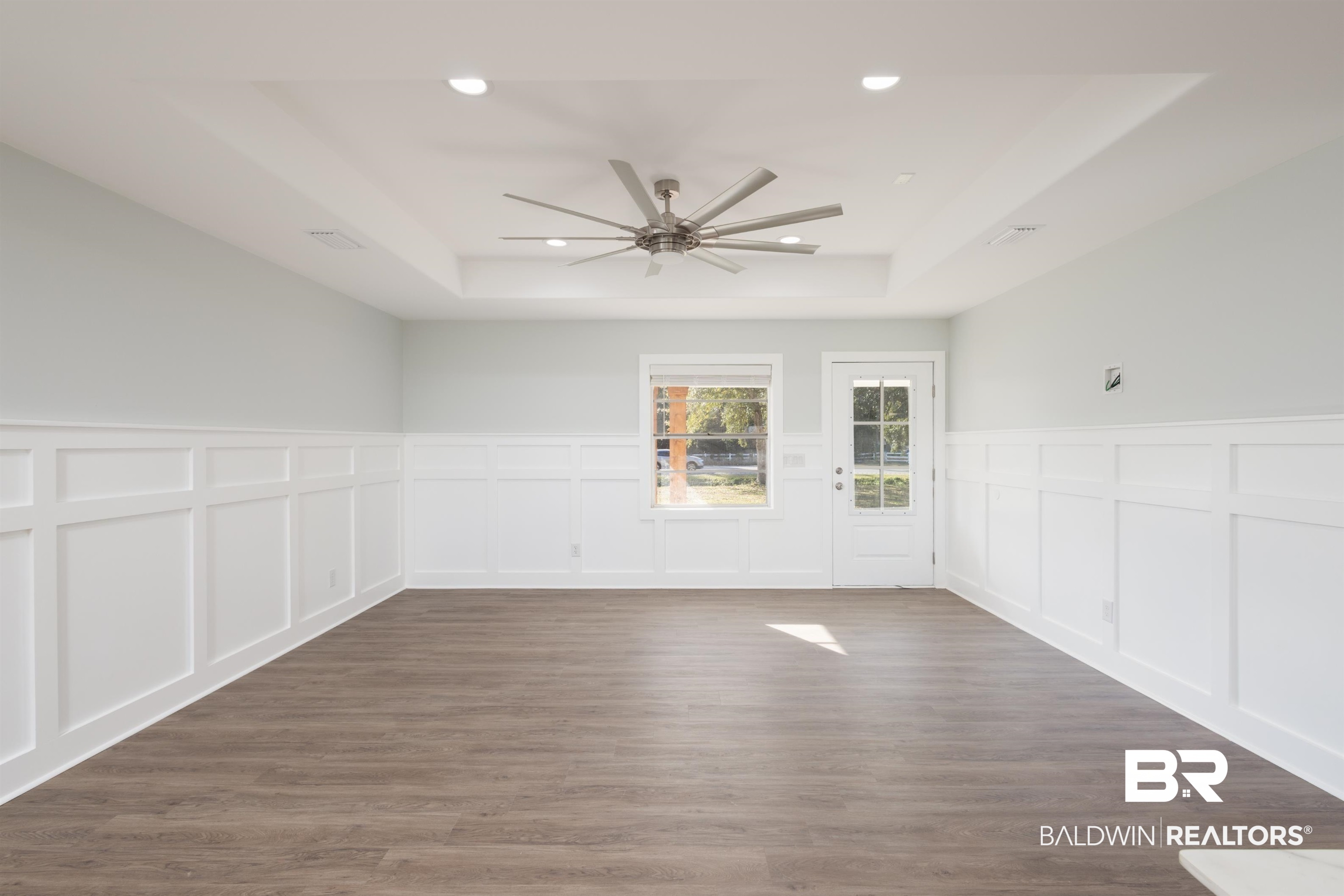 18267 Highway 98 Foley, AL 36535 - Photo 7 of 26 Empty room featuring a tray ceiling, dark wood-style flooring, recessed lighting, and ceiling fan