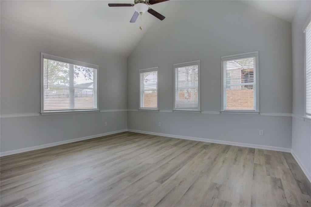 1007 Towne Circle Social Circle, GA 30025 - Photo 14 of 38 wooden floor in an empty room with a window