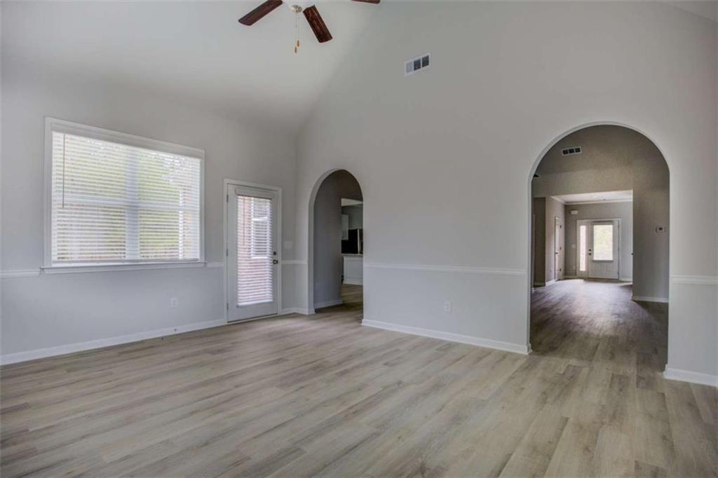 1007 Towne Circle Social Circle, GA 30025 - Photo 15 of 38 wooden floor in an empty room with a window