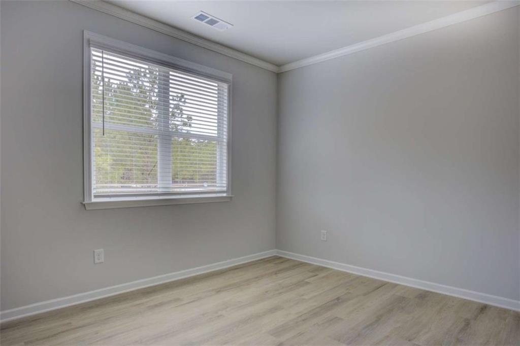 1007 Towne Circle Social Circle, GA 30025 - Photo 23 of 38 an empty room with a window