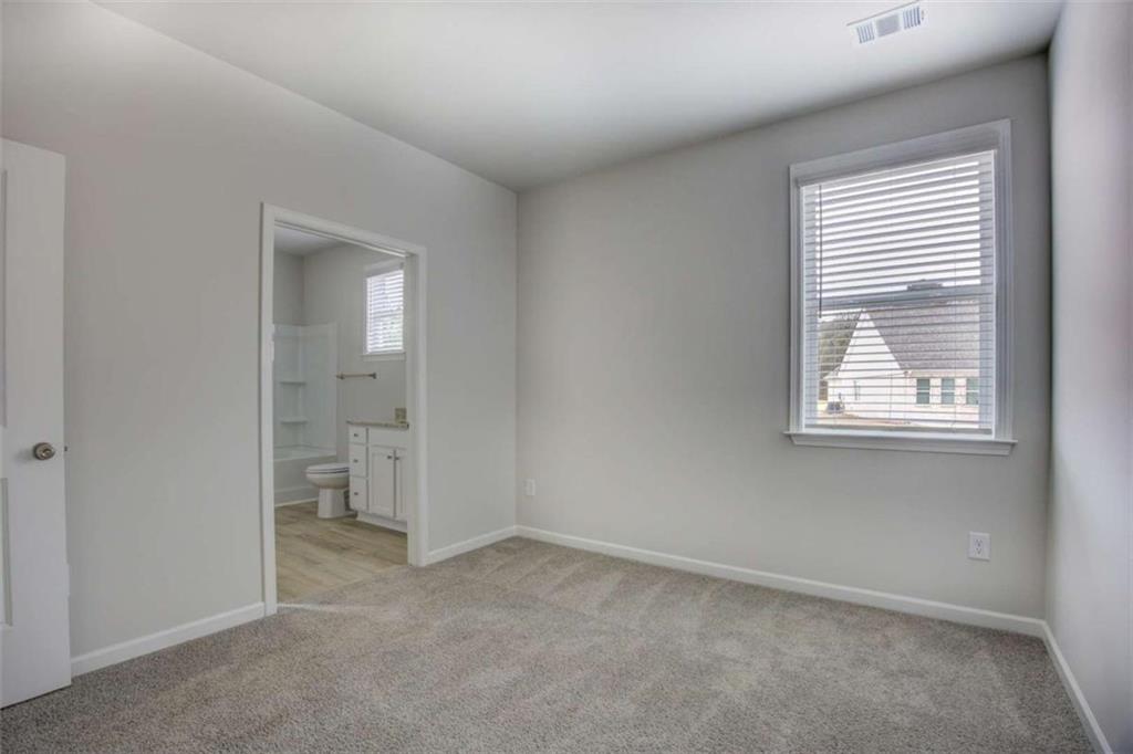 1007 Towne Circle Social Circle, GA 30025 - Photo 34 of 38 an empty room with windows and closet