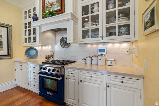390 North 100 West Monroe, UT 84754 - Photo 7 of 167 Kitchen featuring white cabinets, range with gas cooktop, glass insert cabinets, and decorative backsplash