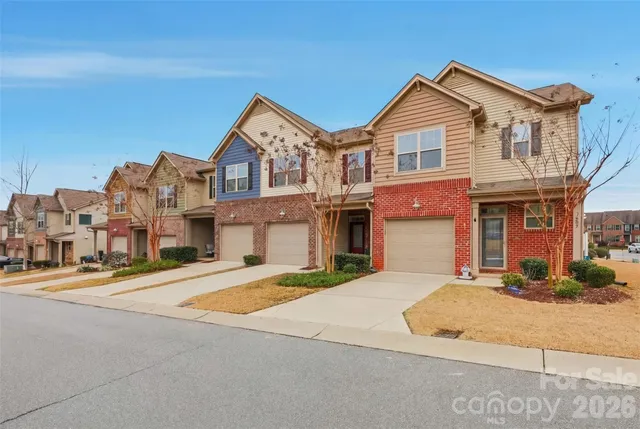 a aerial view of a house with a yard