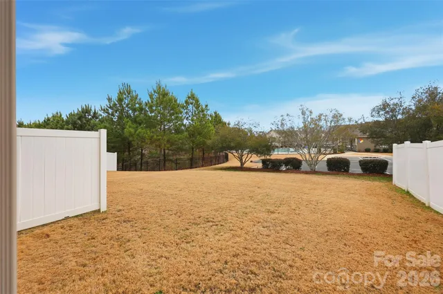 an aerial view of a house with a swimming pool