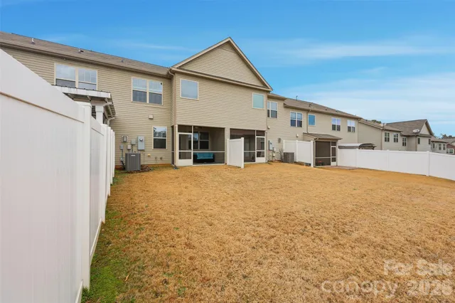 an aerial view of a residential apartment building with swimming pool