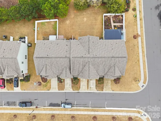 an aerial view of a house with a garden