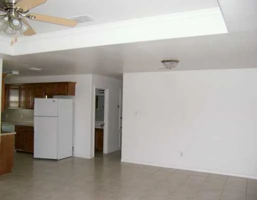 a kitchen with a sink a refrigerator and a stove