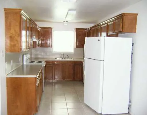 a kitchen with a refrigerator a sink and dishwasher