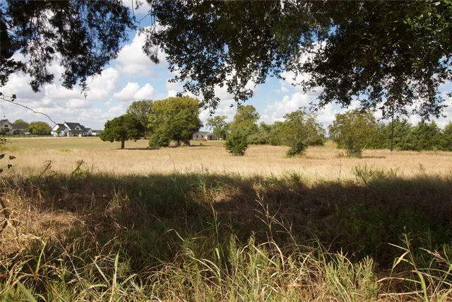 a view of lake with green space