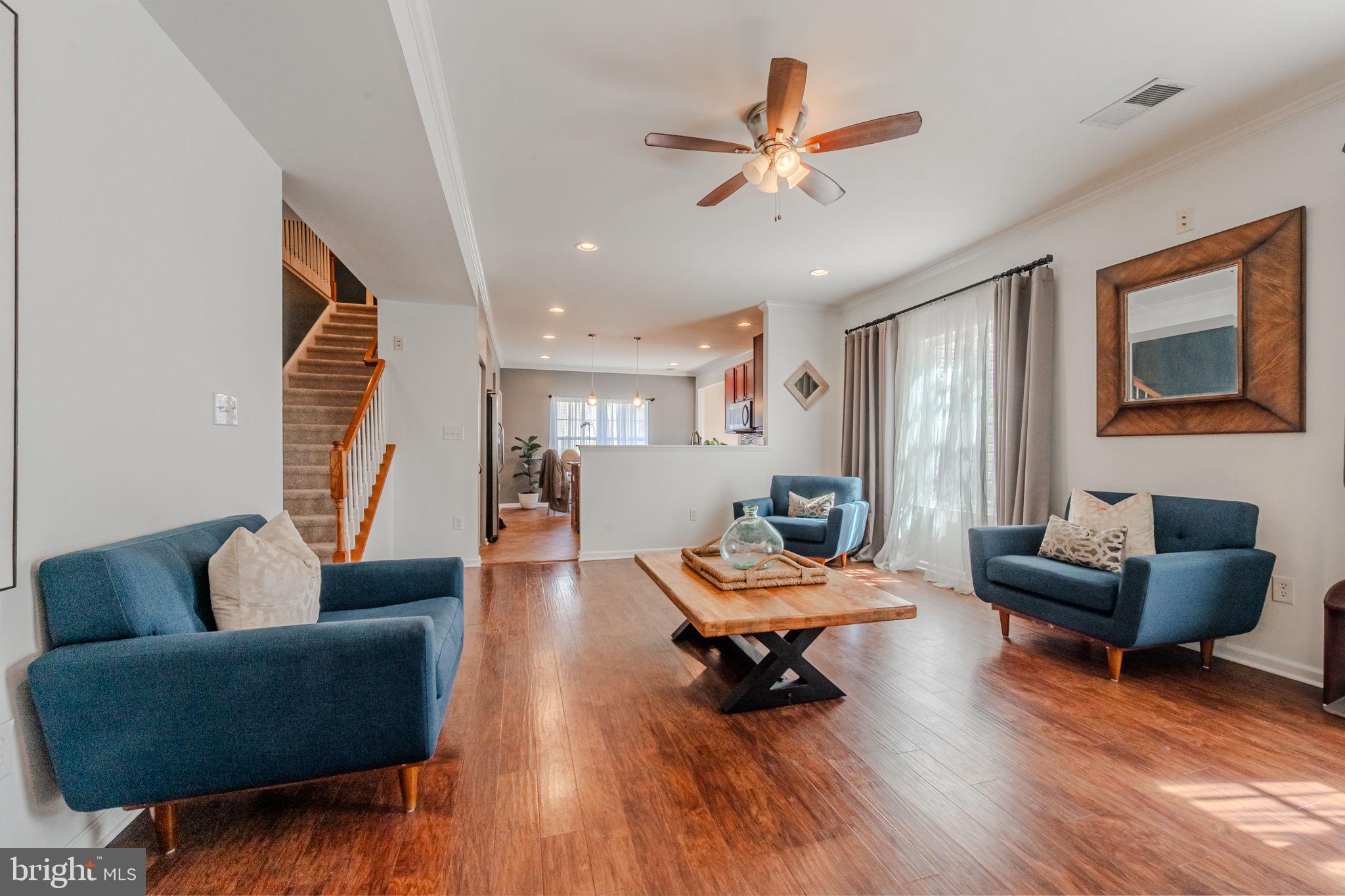 216 Alloway Place Townsend, DE 19734 - Photo 14 of 40 a living room with furniture and a wooden floor