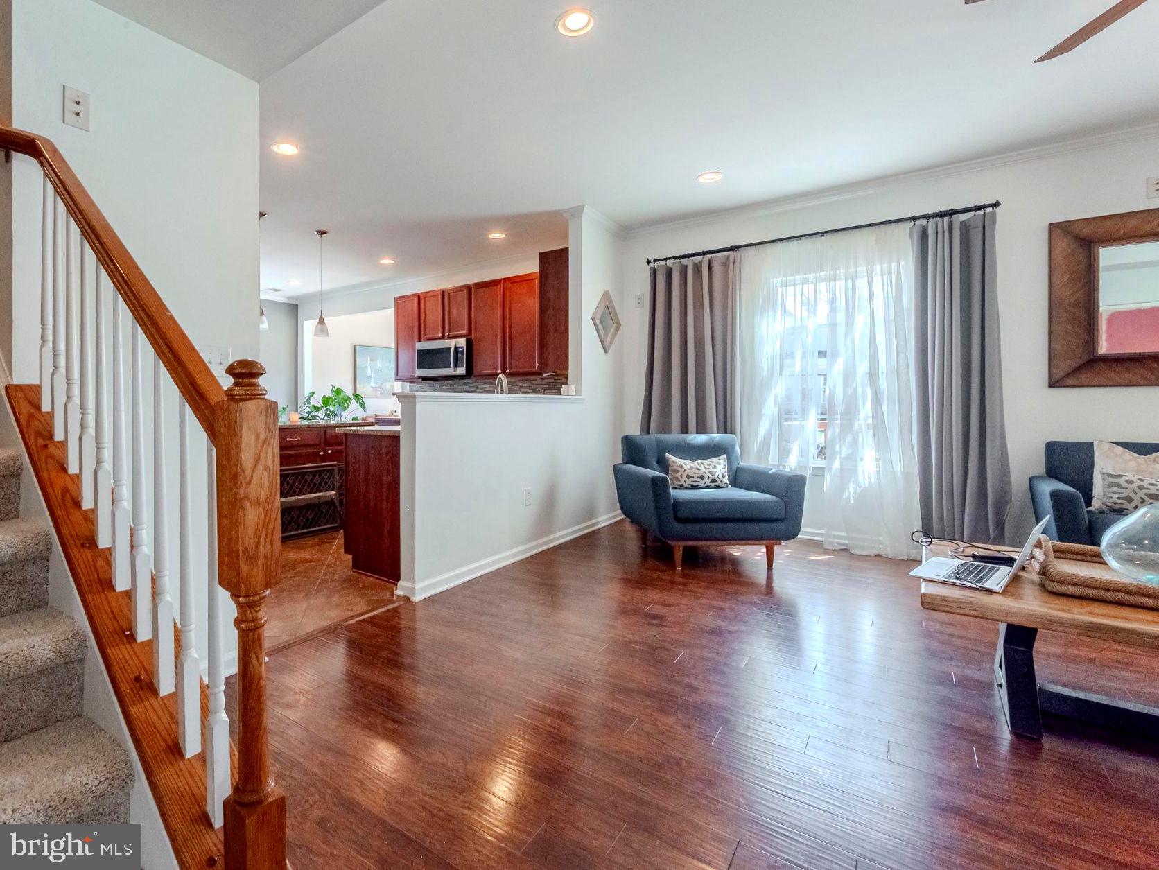 216 Alloway Place Townsend, DE 19734 - Photo 15 of 40 a living room with furniture and a wooden floor