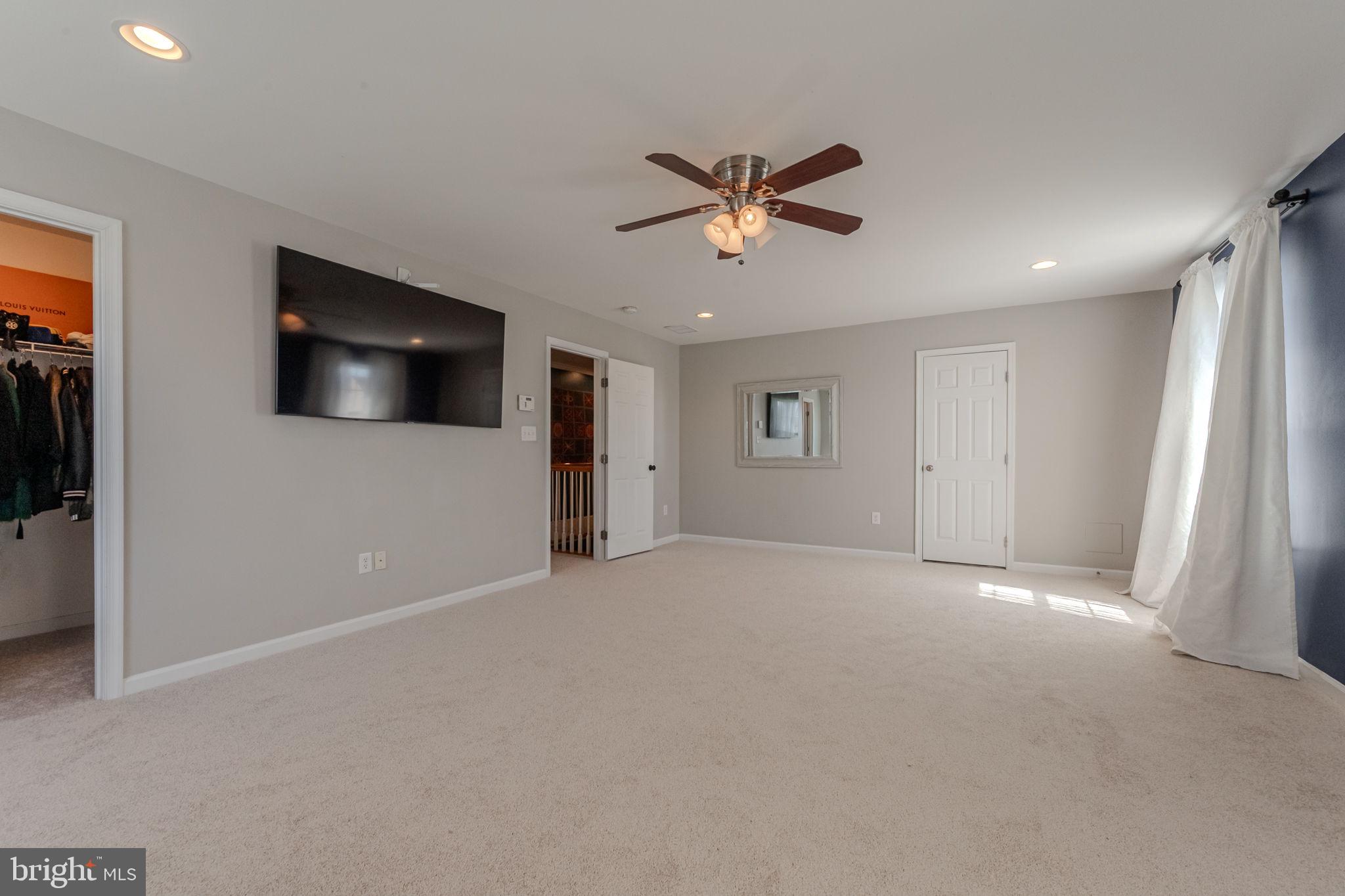 216 Alloway Place Townsend, DE 19734 - Photo 18 of 40 a view of a livingroom with a flat screen tv