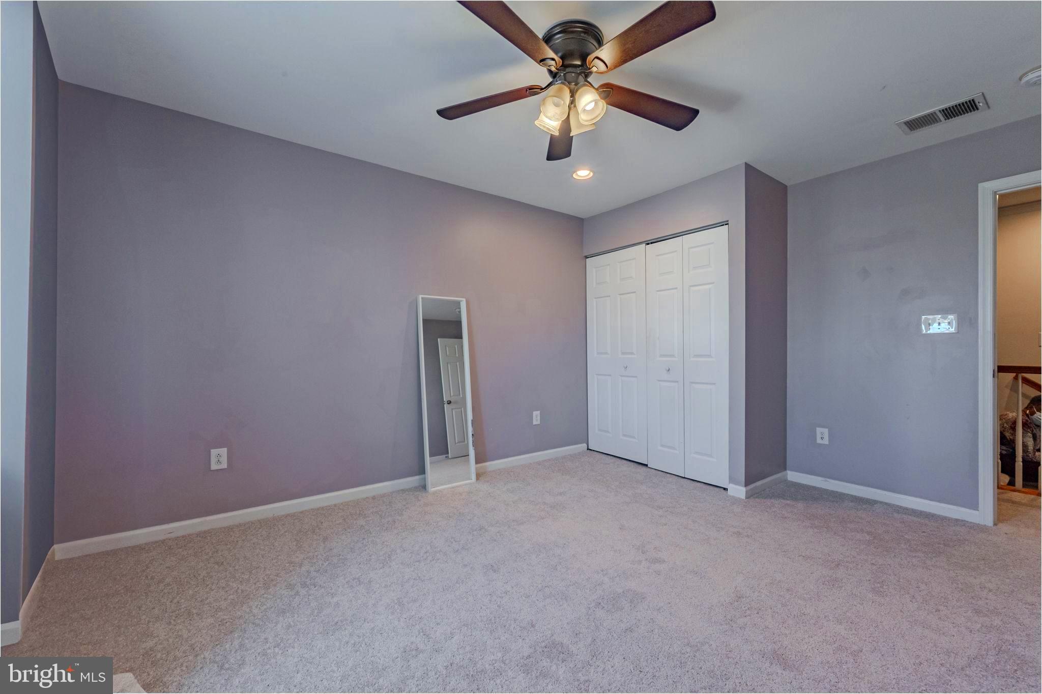 216 Alloway Place Townsend, DE 19734 - Photo 21 of 40 an empty room with closet and a chandelier fan