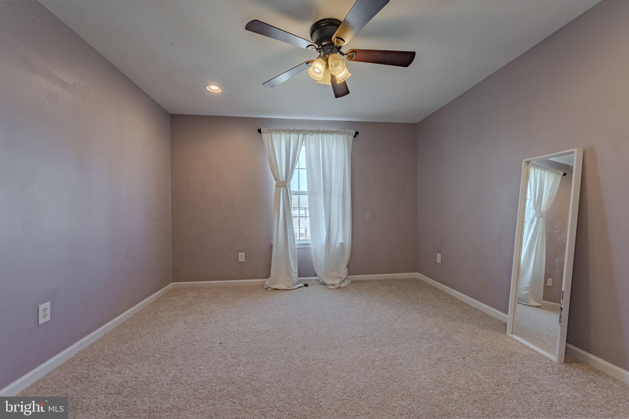 216 Alloway Place Townsend, DE 19734 - Photo 22 of 40 an empty room with windows and fan