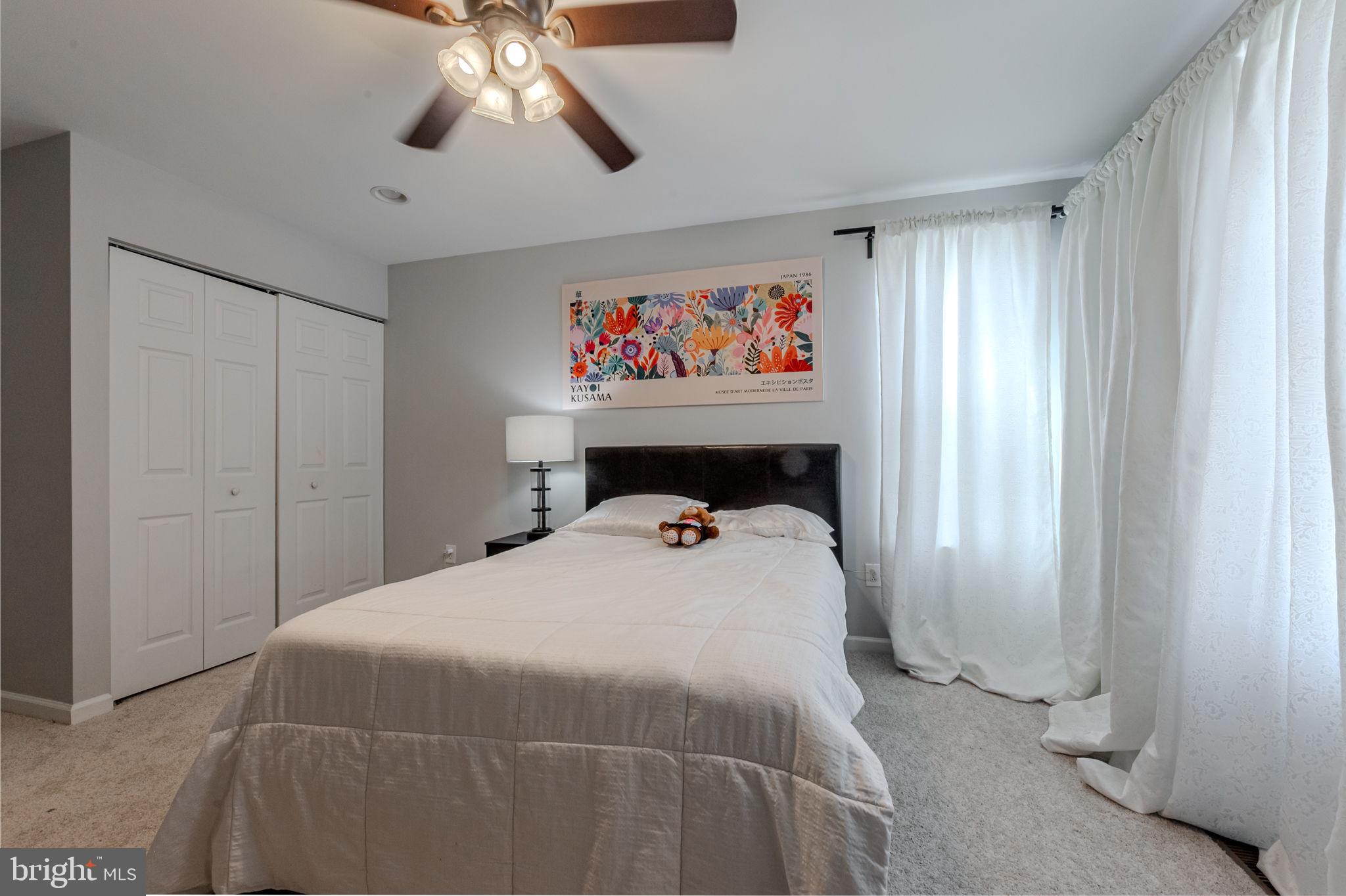 216 Alloway Place Townsend, DE 19734 - Photo 27 of 40 a bedroom with a bed and a chandelier