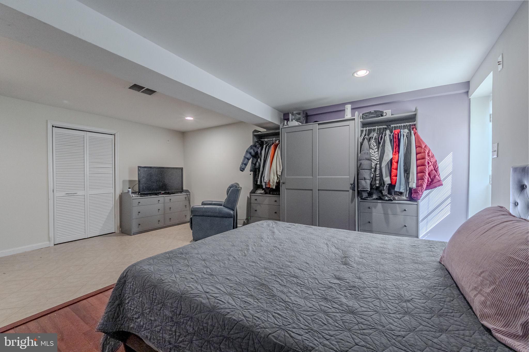 216 Alloway Place Townsend, DE 19734 - Photo 32 of 40 a bed room with a bed and a television