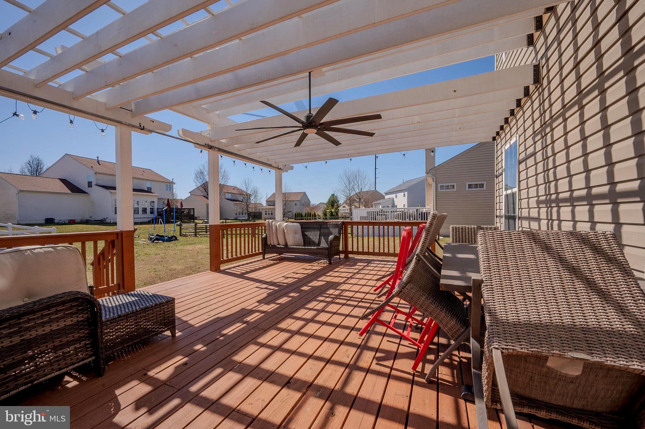 216 Alloway Place Townsend, DE 19734 - Photo 34 of 40 a living room with lots of furniture and kitchen view