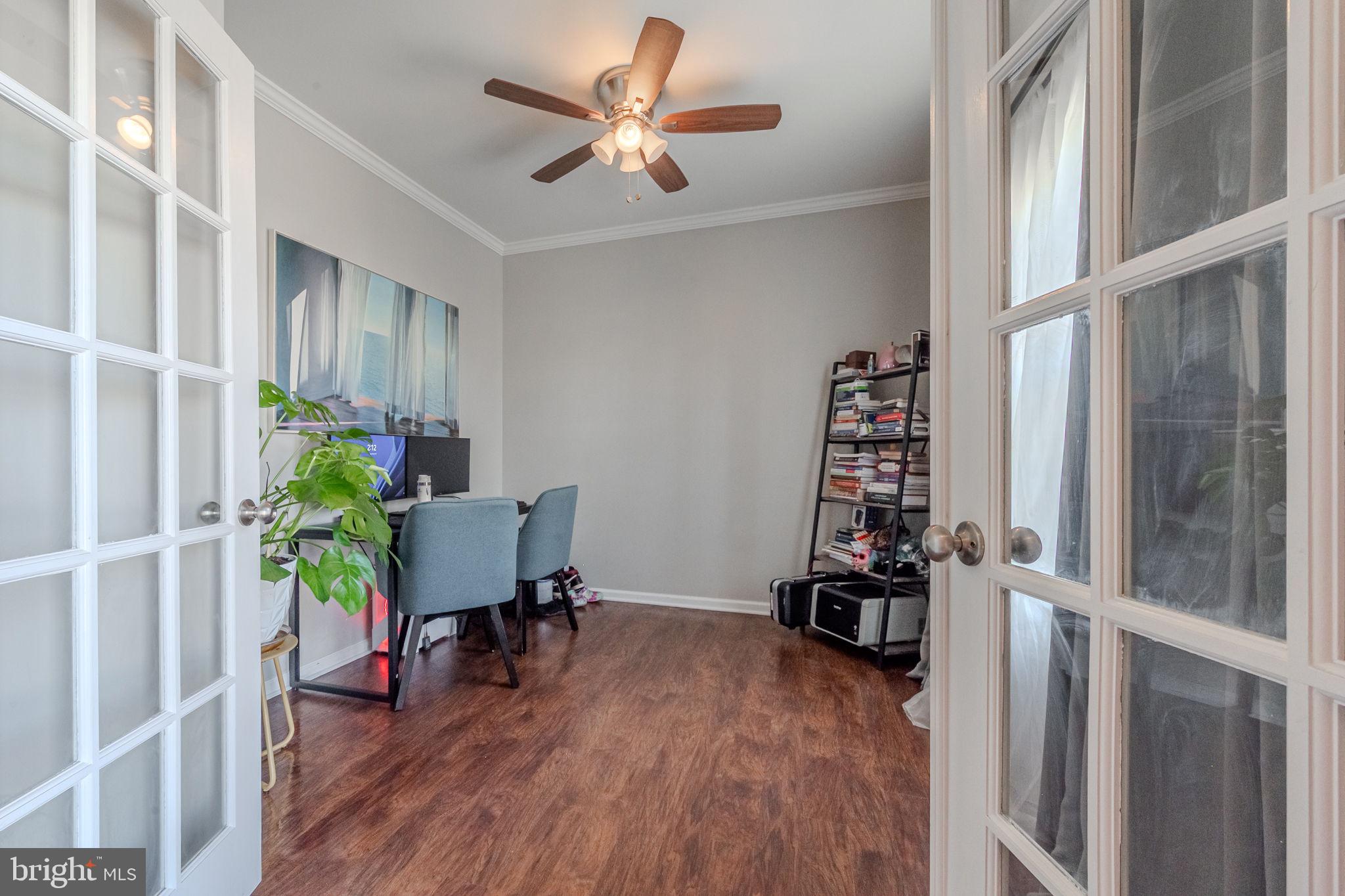 216 Alloway Place Townsend, DE 19734 - Photo 5 of 40 a view of a workspace with furniture and a potted plant