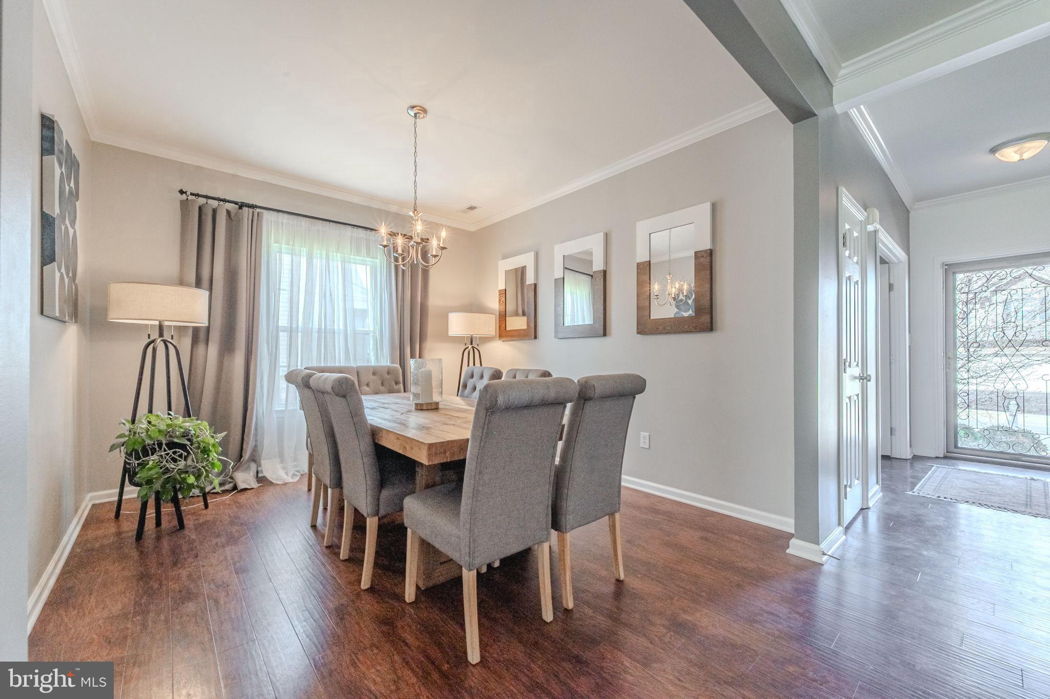 216 Alloway Place Townsend, DE 19734 - Photo 6 of 40 a view of a dining room with furniture window and wooden floor