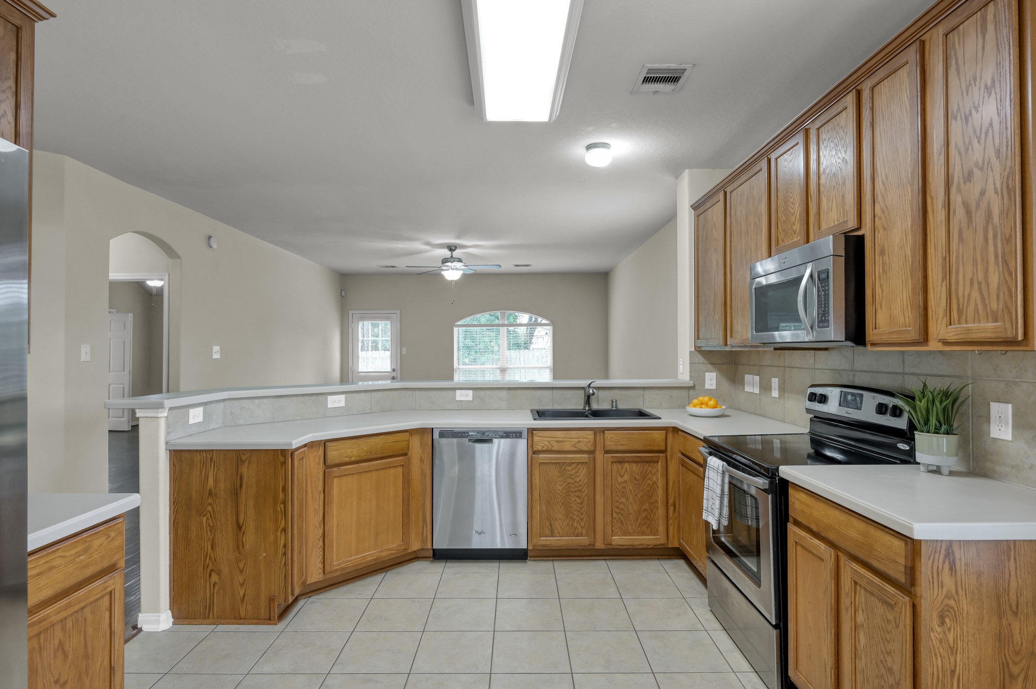 631 Timberstand Lane Spring, TX 77373 - Photo 17 of 38 Enjoy a bright and open kitchen layout with generous counter space and a seamless view into the family room.