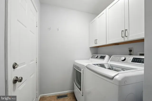 a view of hallway with wooden floor and stairs