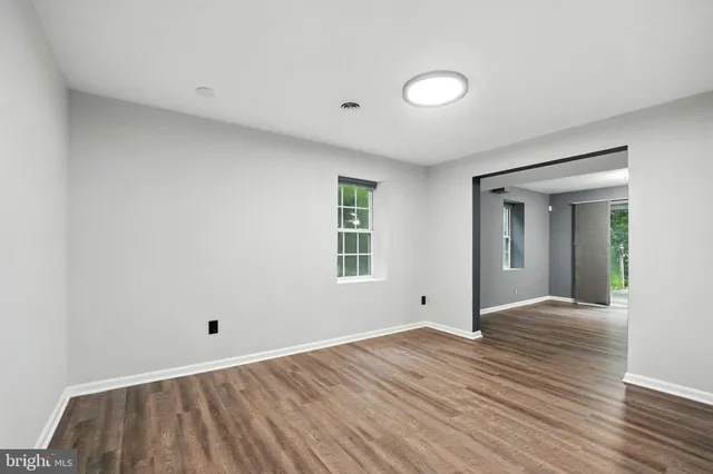 a view of house with a backyard