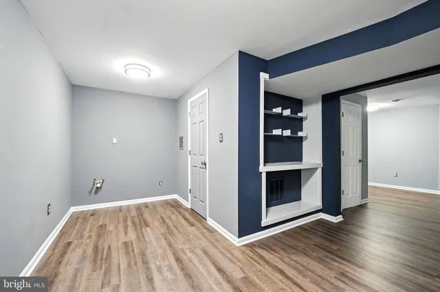 a view of a backyard with a garden and entertaining space