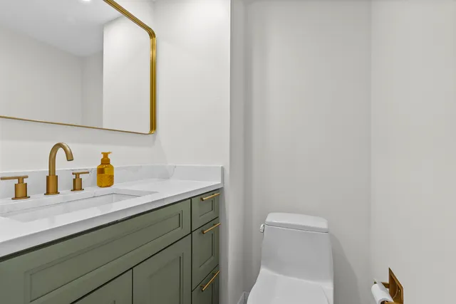 a bathroom with a sink and a vanity