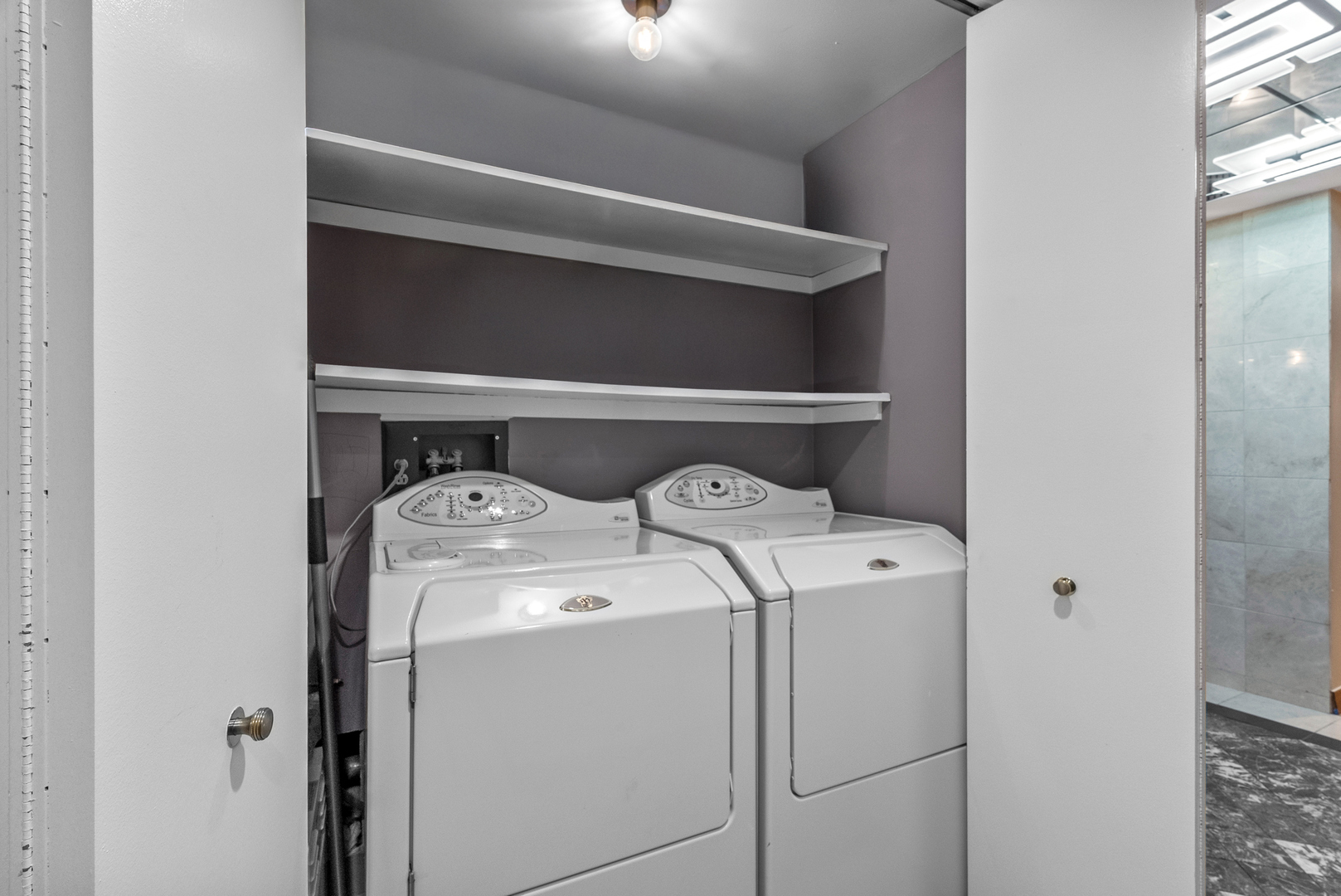 950 North Michigan Avenue, Unit 3704 Chicago, IL 60611 - Photo 22 of 33 a utility room with dryer and washer