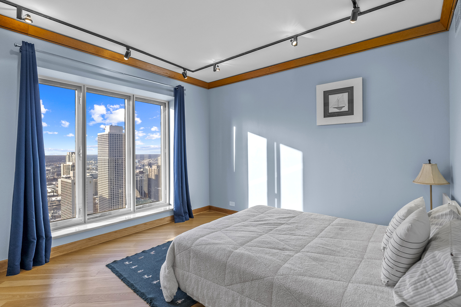 950 North Michigan Avenue, Unit 3704 Chicago, IL 60611 - Photo 24 of 33 a bedroom with a bed and a large window with outer view
