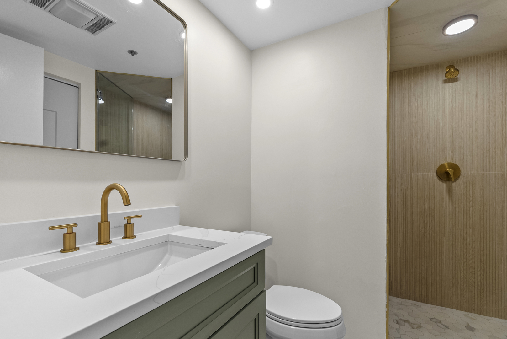 950 North Michigan Avenue, Unit 3704 Chicago, IL 60611 - Photo 27 of 33 a bathroom with a sink a toilet and mirror