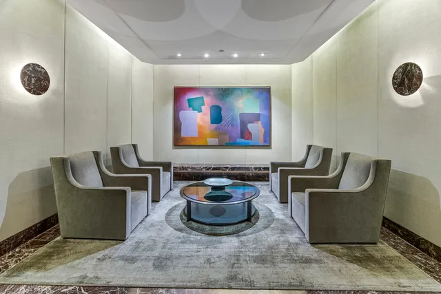 a living room with furniture and air hockey table